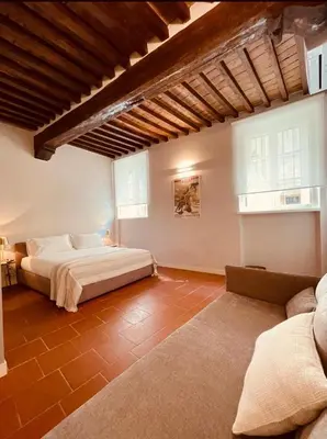 Letto o letti in una camera di Palazzo Borgocolonne Apartments - Manu Maison