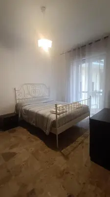 Letto o letti in una camera di Battisti