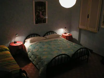 Letto o letti in una camera di La Buonanotte