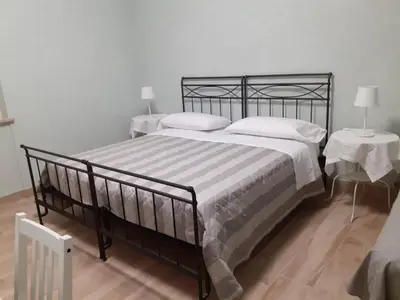 Letto o letti in una camera di La Buonanotte