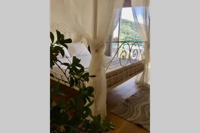 Letto o letti in una camera di splendido appartamento vista mare