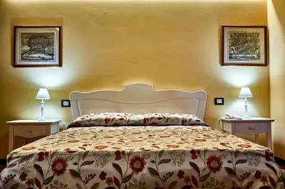 Letto o letti in una camera di Albergo Trattoria Il Leone