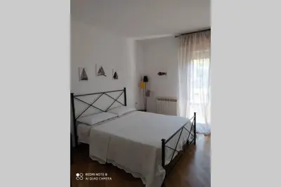 Letto o letti in una camera di Casa Riccò di Cinzia e Samuele