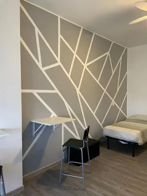 Letto o letti in una camera di Residence Corso Europa