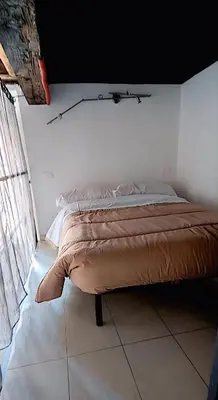 Letto o letti in una camera di La Darsena
