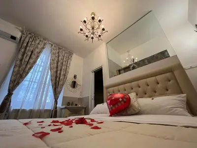 Letto o letti in una camera di Notte Rosa Suites & Relax