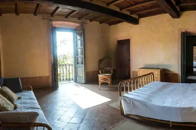 Letto o letti in una camera di Villa Bottini in esclusiva