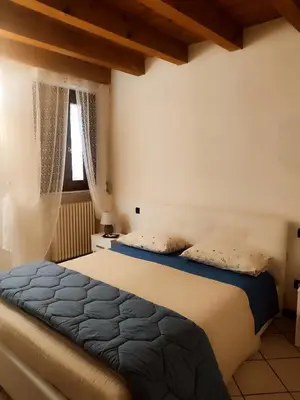 Letto o letti in una camera di Ca' degli Sposi