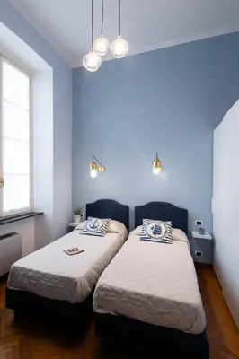 Letto o letti in una camera di Casa Garibalda - seafronf apartment