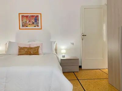 Letto o letti in una camera di CasaViva- Ampio e luminoso quadrilocale a Rapallo