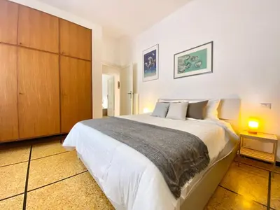 Letto o letti in una camera di CasaViva- Ampio e luminoso quadrilocale a Rapallo