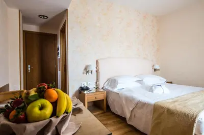 Letto o letti in una camera di Hotel Touring