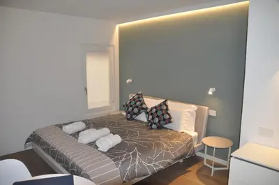 Letto o letti in una camera di Modena Charme Belle Arti