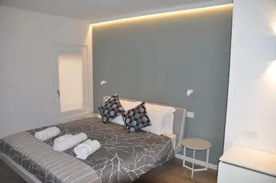 Letto o letti in una camera di Modena Charme Belle Arti