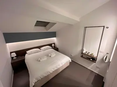Letto o letti in una camera di Mutina Suites
