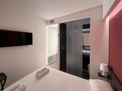 Letto o letti in una camera di Mutina Suites