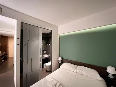 Letto o letti in una camera di Mutina Suites