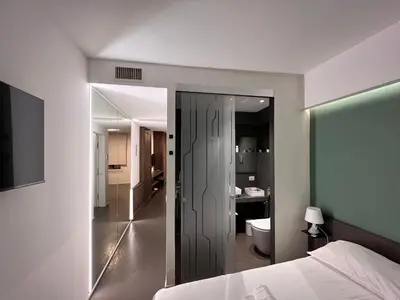Letto o letti in una camera di Mutina Suites