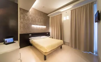 Letto o letti in una camera di Savoy Hotel