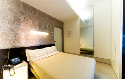 Letto o letti in una camera di Savoy Hotel