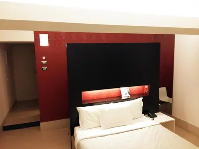 Letto o letti in una camera di Savoy Hotel