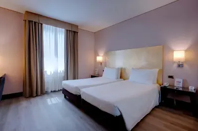 Letto o letti in una camera di Hotel Nord