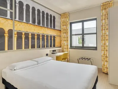 Letto o letti in una camera di B&B Hotel Cremona