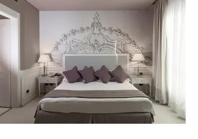 Letto o letti in una camera di Grand Hotel De La Ville