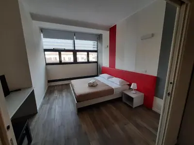 Letto o letti in una camera di STOP&GO Suites and Apartments