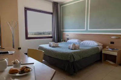 Letto o letti in una camera di Hotel Ayri
