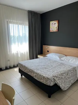 Letto o letti in una camera di Hotel Ayri
