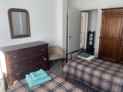 Letto o letti in una camera di Casa Bianca 4 - confortevole in centro a Moneglia