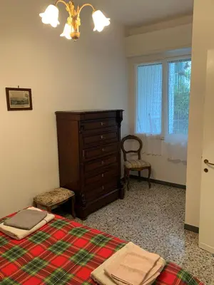 Letto o letti in una camera di Casa Bianca 4 - confortevole in centro a Moneglia