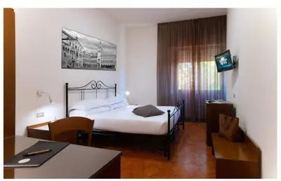 Letto o letti in una camera di CDH Hotel Modena