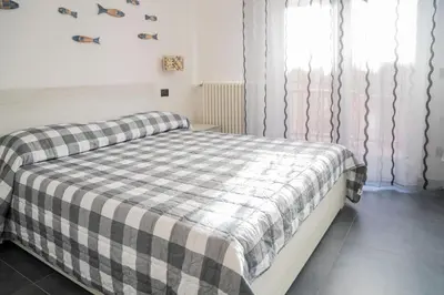 Letto o letti in una camera di 021 - Casa Ponente con Terrazzo - CENTRO città, Carruggio e Mare BAIA DEL SILENZIO a 500 m