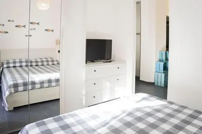 Letto o letti in una camera di 021 - Casa Ponente con Terrazzo - CENTRO città, Carruggio e Mare BAIA DEL SILENZIO a 500 m