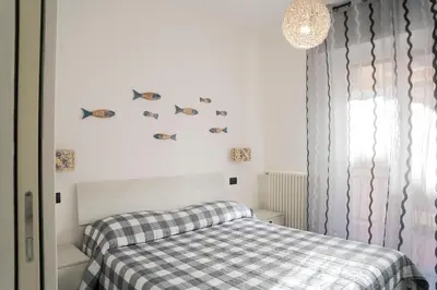 Letto o letti in una camera di 021 - Casa Ponente con Terrazzo - CENTRO città, Carruggio e Mare BAIA DEL SILENZIO a 500 m