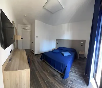 Letto o letti in una camera di Tiby Hotel
