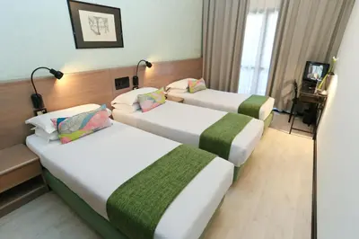 Letto o letti in una camera di Hotel Forum