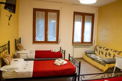 Letto o letti in una camera di Emmanueli65 fronte clinica per 4 matrimoniale e castello