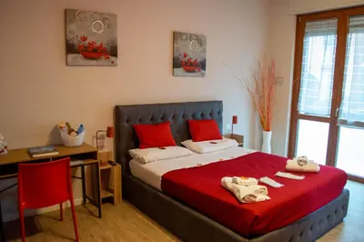 Letto o letti in una camera di Emmanueli65 fronte clinica per 4 matrimoniale e castello