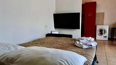 Letto o letti in una camera di FGH Apartment ZONA FIERA FREE PARKING