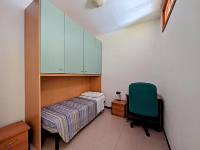 Letto o letti in una camera di Residenza Parco dei Tigli