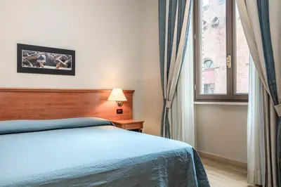 Letto o letti in una camera di Hotel Impero