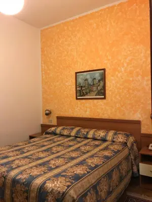 Letto o letti in una camera di Hotel Garden Ristorante