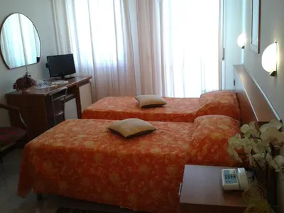 Letto o letti in una camera di Hotel Garden Ristorante