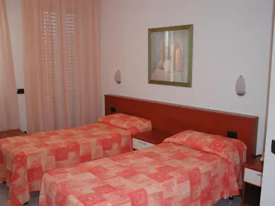 Letto o letti in una camera di Hotel Garden Ristorante