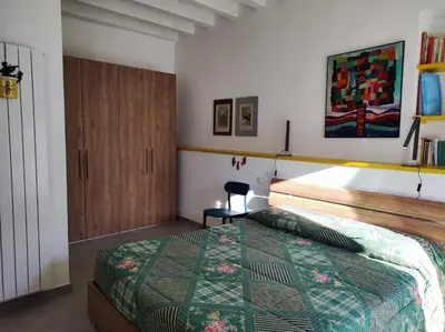 Letto o letti in una camera di Casa dei giuggioli