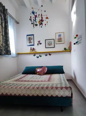 Letto o letti in una camera di Casa dei giuggioli