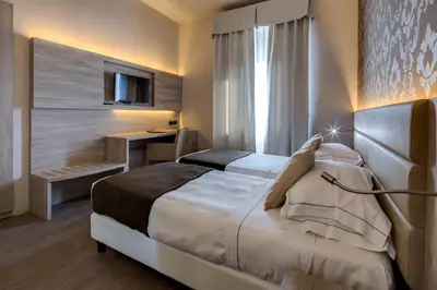 Letto o letti in una camera di Hotel San Marco & Formula Club